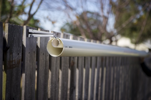 Stop dog jumping on sale fence pvc pipe