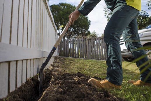 Ideas to keep dogs shop from digging under fence