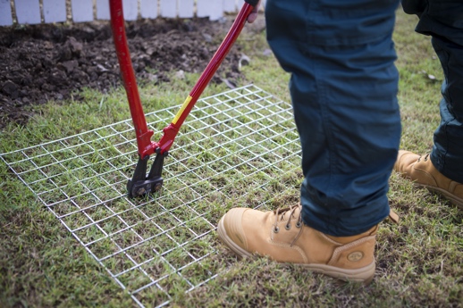 How do i stop my shop dog from digging under the fence